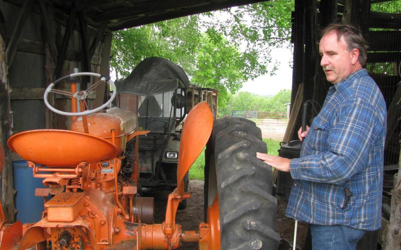 Brinkmann restores J.I. Case tractors. His grandfather and father owned and operated the J.I. Case dealership in Morrison, and Brinkmann uses mechanical skills learned before his blindness. Photo by Linda Geist