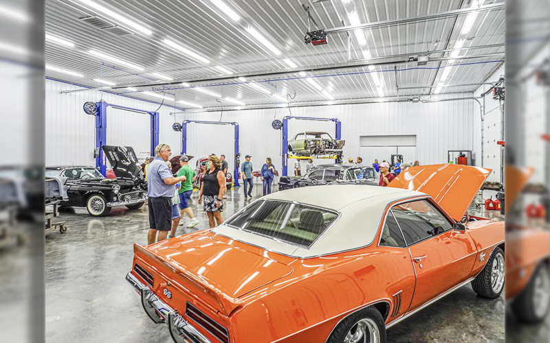 CARS AND TRUCKS ON DISPLAY in various stages of restoration.