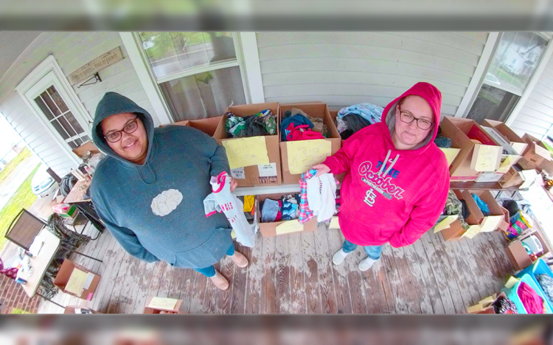 PENNY DEWROCK AND KEERSTIN MASON selling clothing from the porch.