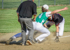 Charlie Roth tags a player out at third base.