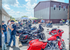 BIKERS ON THE 2ND ANNUAL TURTLE RUN stop at Hilltop on their loop to have a break and consume some Kruse Benefit BBQ.