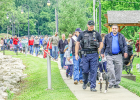 NEW HAVEN POLICE CHIEF CHRIS HAMMANN and the K-9 unit of Jet and Officer Kyle Walters lead the Childrens’ parade along the Levee.