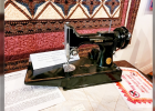 A 1947 SINGER FEATHERWEIGHT SEWING MACHINE, owned by the talented Lois Mueller.