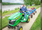 RANDY SCHWENKERT taking excited kids on tractor rides during the festival.