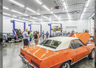 CARS AND TRUCKS ON DISPLAY in various stages of restoration.